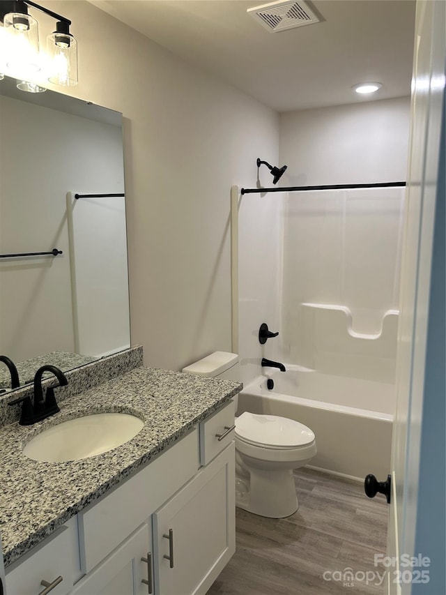 1218 Fall Day Cir SW, Lenoir, NC 28645 - bathroom with shower / washtub combination, wood finished floors, visible vents, toilet, and vanity