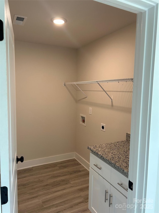 1218 Fall Day Cir SW, Lenoir, NC 28645 - laundry room with hookup for a washing machine, electric dryer hookup, baseboards, dark wood-style flooring, and laundry area