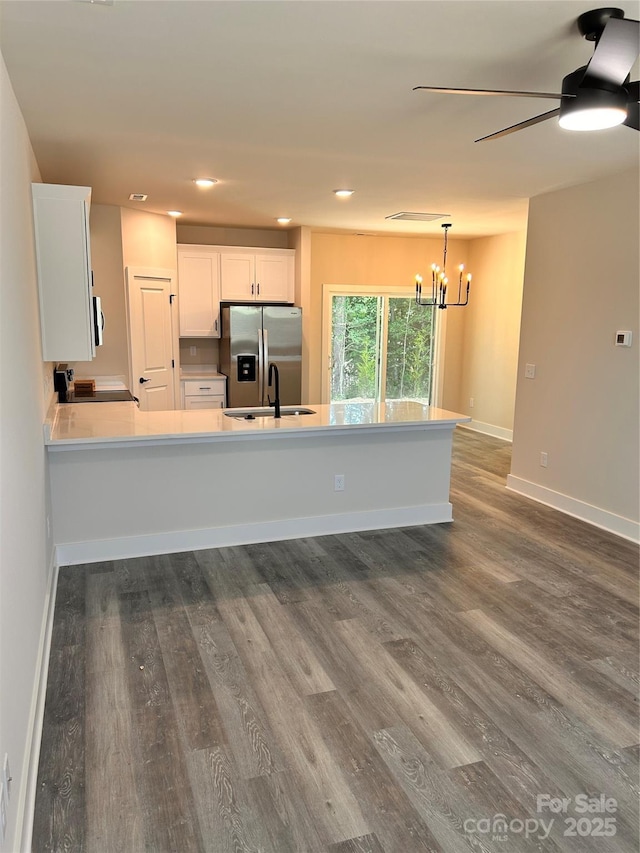 1218 Fall Day Cir SW, Lenoir, NC 28645 - kitchen featuring stainless steel fridge, a chandelier, white cabinets, dark wood-type flooring, and recessed lighting