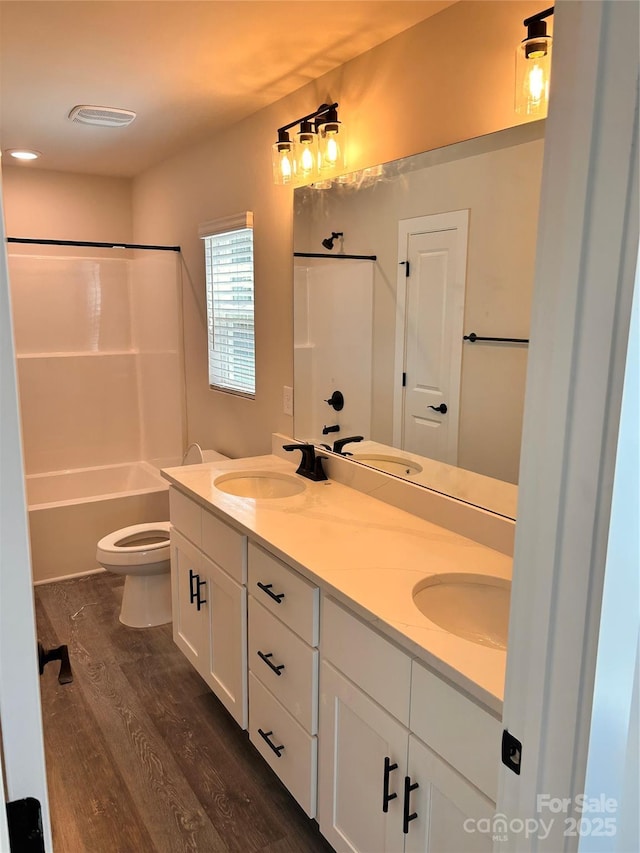 1218 Fall Day Cir SW, Lenoir, NC 28645 - bathroom with wood finished floors, double vanity, and bathtub / shower combination