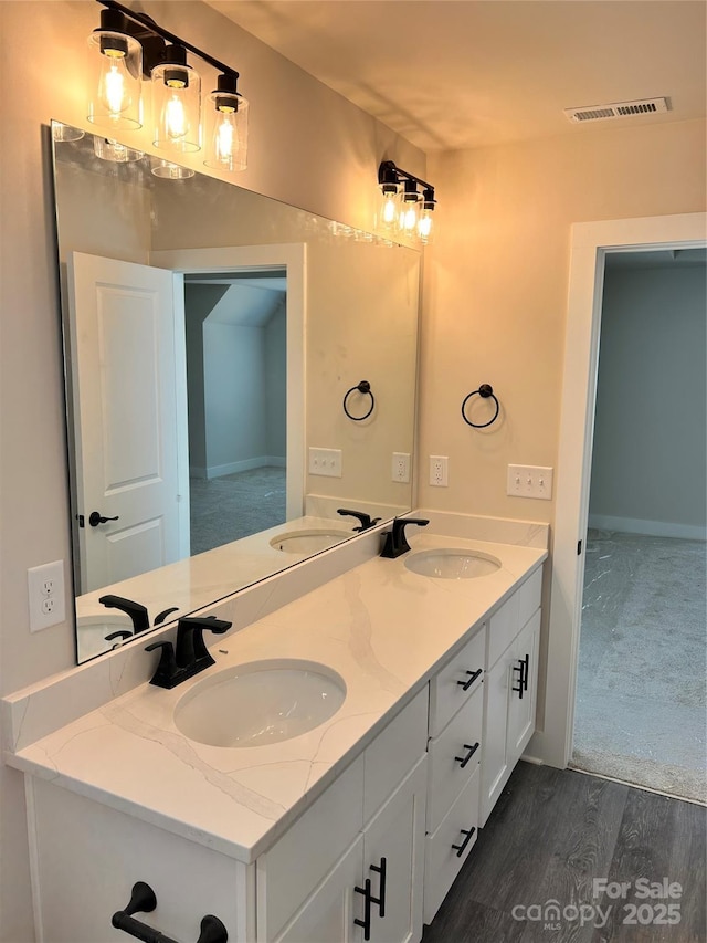 1218 Fall Day Cir SW, Lenoir, NC 28645 - bathroom featuring double vanity and wood finished floors