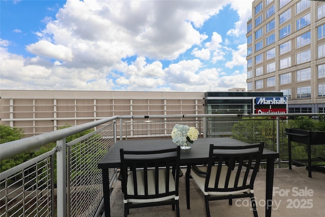 balcony with outdoor dining area