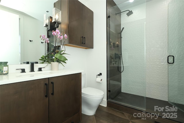 full bath with toilet, walk in shower, and vanity