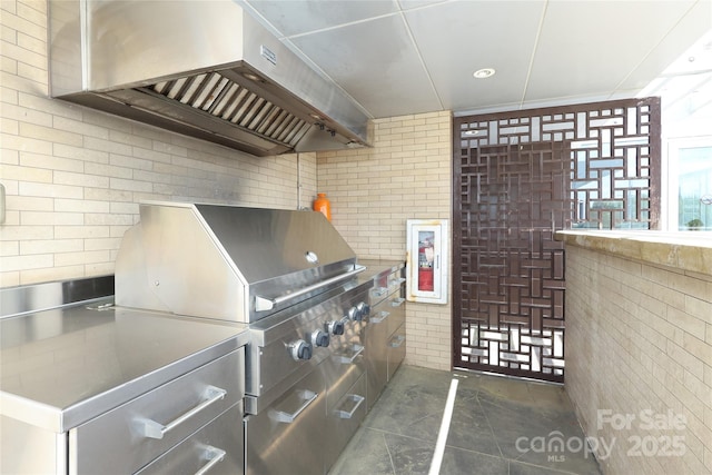 miscellaneous room with dark tile patterned flooring