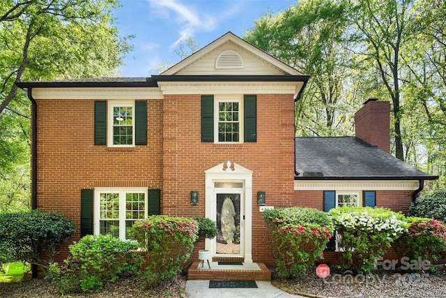 4522 Woods End Ln, Charlotte, NC 28277 - view of front of house with brick siding, a chimney, and a shingled roof