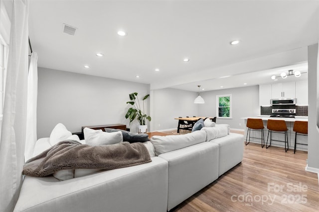 4522 Woods End Ln, Charlotte, NC 28277 - living room featuring recessed lighting, light wood-type flooring, and baseboards