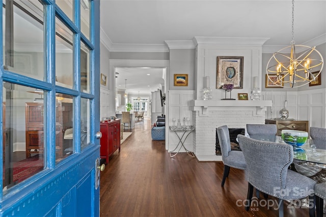 806 Sunnyside Ave, Charlotte, NC 28204 - dining area featuring a chandelier, crown molding, and dark wood-type flooring