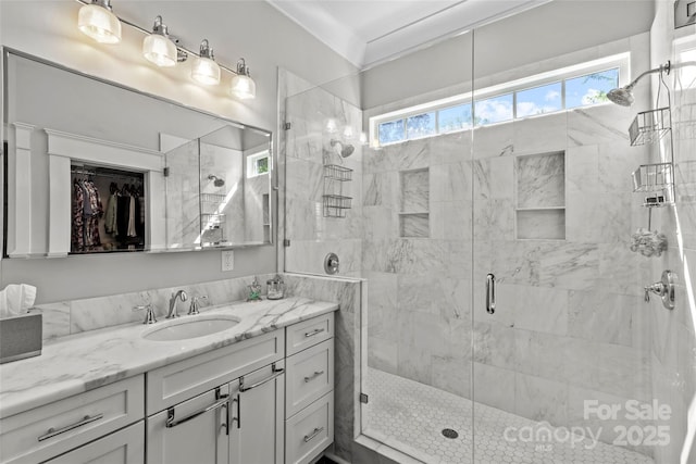 806 Sunnyside Ave, Charlotte, NC 28204 - bathroom with vanity, a stall shower, and a walk in closet