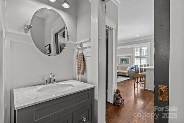 806 Sunnyside Ave, Charlotte, NC 28204 - bathroom featuring wood finished floors, vanity, and crown molding