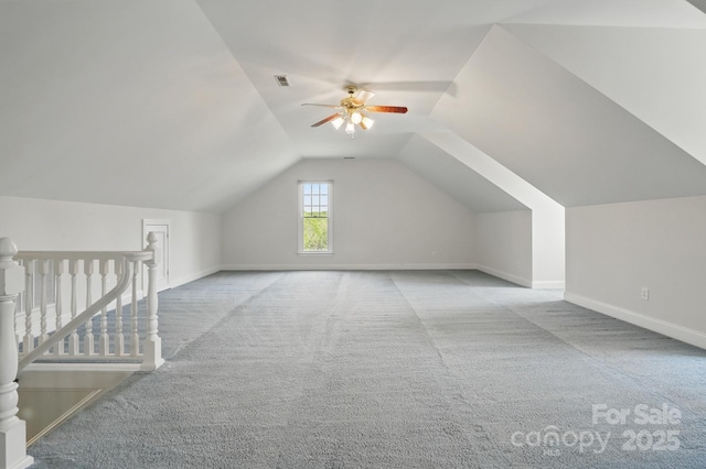 bonus room featuring carpet, visible vents, a ceiling fan, and baseboards
