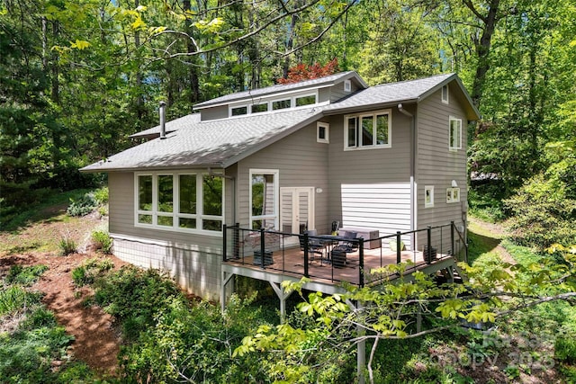 27 Stokes Dr, Asheville, NC 28805 - rear view of house featuring a shingled roof, a wooden deck, and a chimney