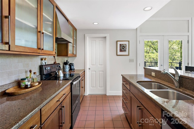 27 Stokes Dr, Asheville, NC 28805 - kitchen featuring black / electric stove, a sink, exhaust hood, dark tile patterned floors, and backsplash