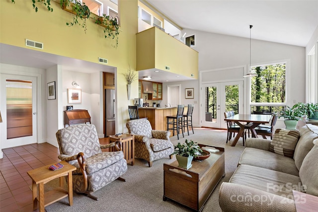 27 Stokes Dr, Asheville, NC 28805 - tiled living room featuring high vaulted ceiling, baseboards, and french doors