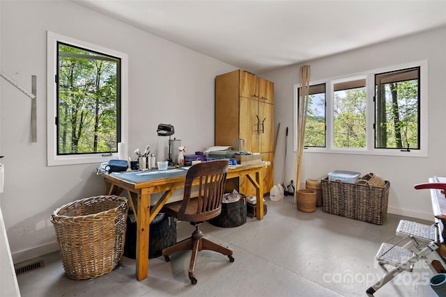27 Stokes Dr, Asheville, NC 28805 - home office with concrete floors, healthy amount of natural light, and baseboards