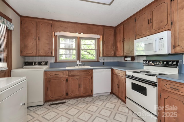 783 Carpenter Ave, Mooresville, NC 28115 - kitchen with white appliances, a sink, brown cabinetry, light countertops, and ornamental molding