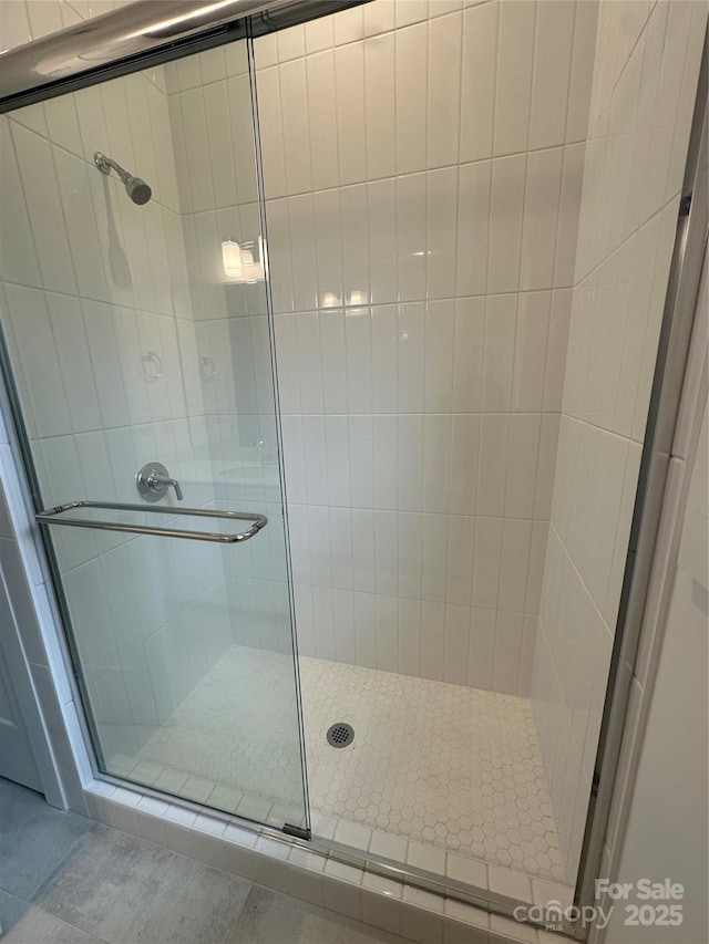 full bath featuring a shower stall