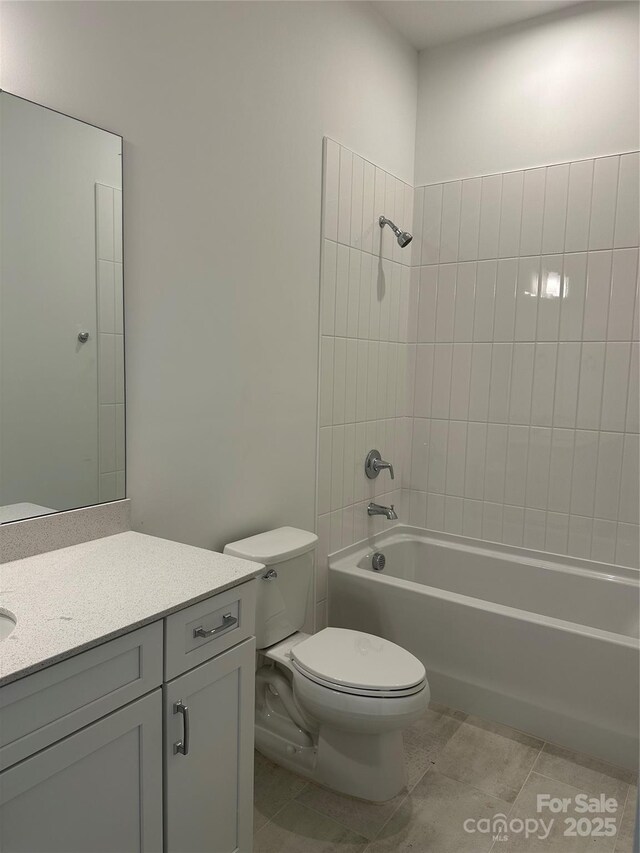 bathroom with shower / bath combination, vanity, toilet, and tile patterned flooring