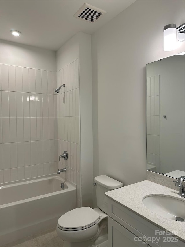bathroom featuring vanity, tile patterned floors,  shower combination, toilet, and visible vents