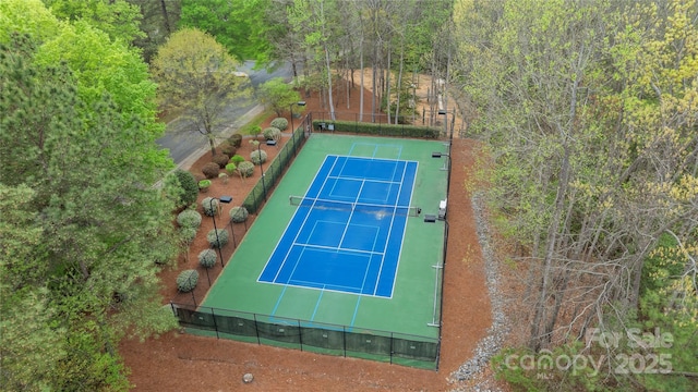 view of tennis court with fence