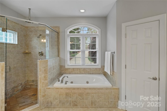 full bath featuring a shower stall and a jetted tub
