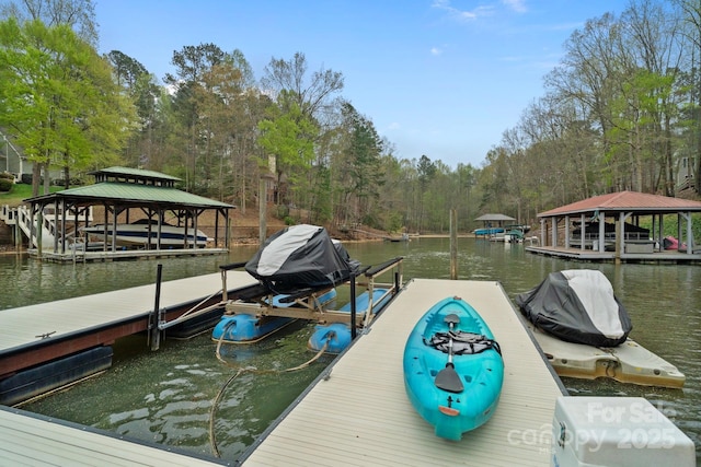 view of dock with boat lift and a water view
