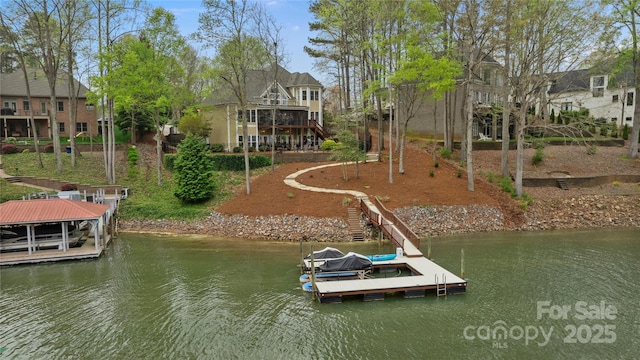 view of dock with boat lift, a water view, and stairway