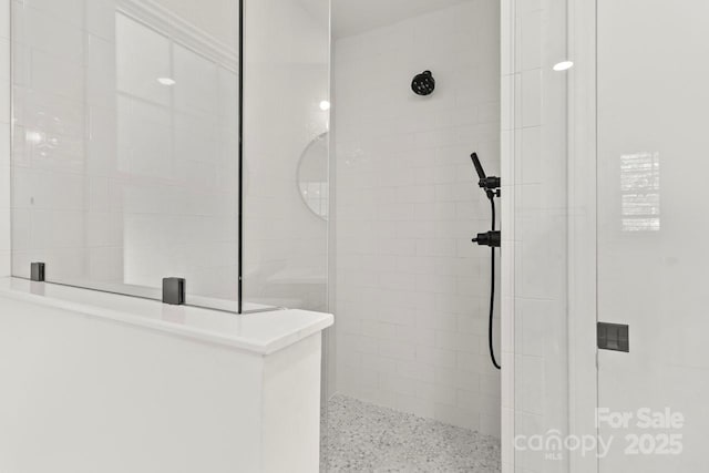 full bathroom with a walk in shower and speckle patterned floor