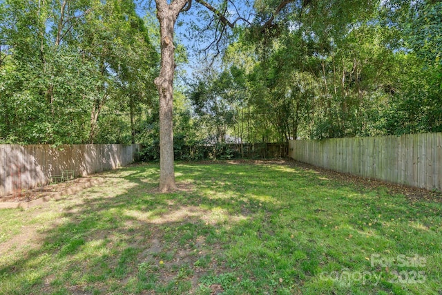 view of yard featuring a fenced backyard