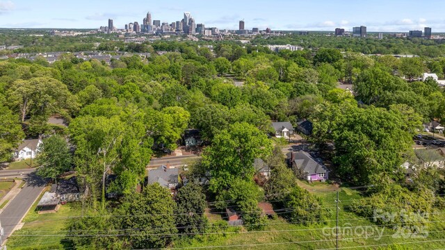 birds eye view of property featuring a city view