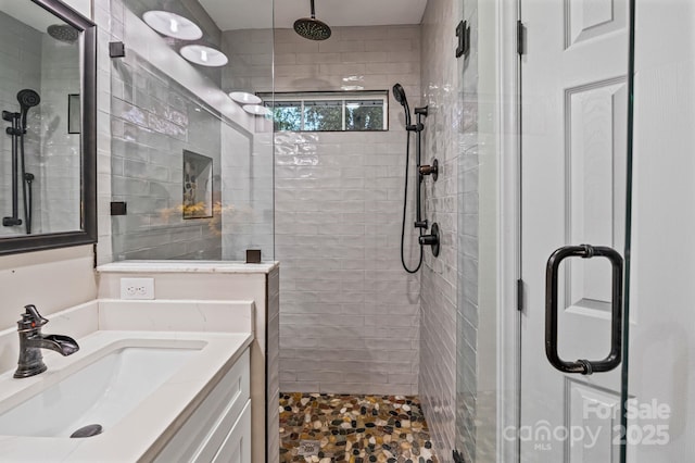 full bath featuring a shower stall and vanity
