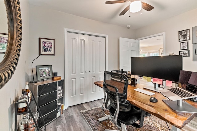 office with wood finished floors and a ceiling fan