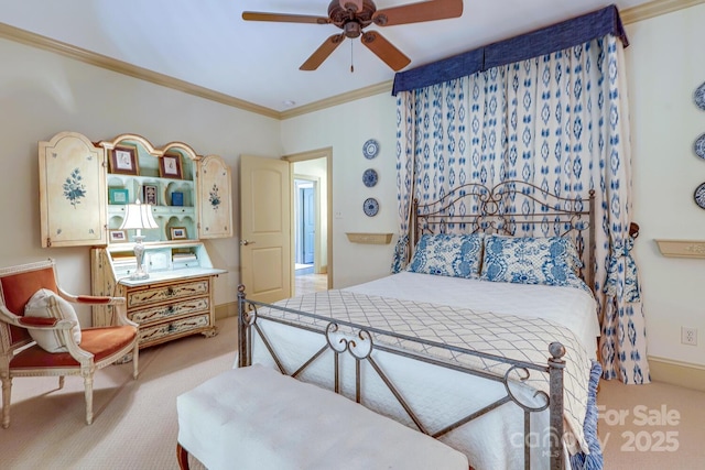 bedroom featuring crown molding, ceiling fan, and light carpet