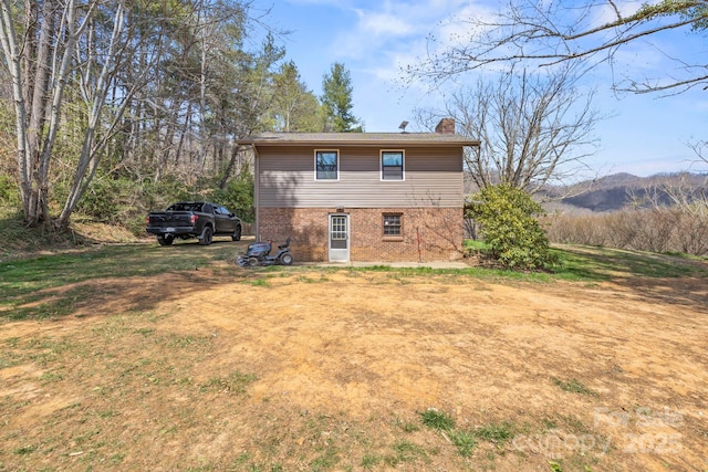 7923 Cruso Rd, Canton, NC 28716 - back of house with brick siding and a chimney