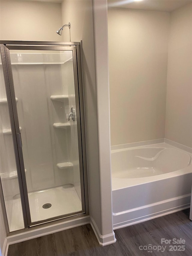 436 Phifer Rd, Kings Mountain, NC 28086 - bathroom featuring wood finished floors, a stall shower, and a bath