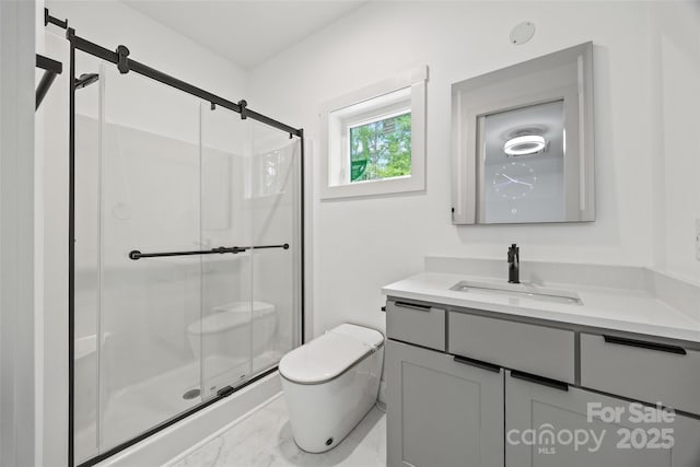 bathroom with a shower stall, marble finish floor, toilet, and vanity