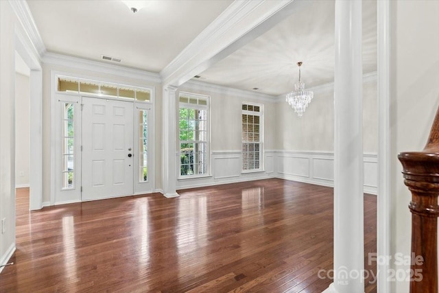 9506 Minnie Lemmond Ln Unit 170, Mint Hill, NC 28227 - foyer entrance featuring hardwood / wood-style floors, crown molding, a chandelier, and wainscoting