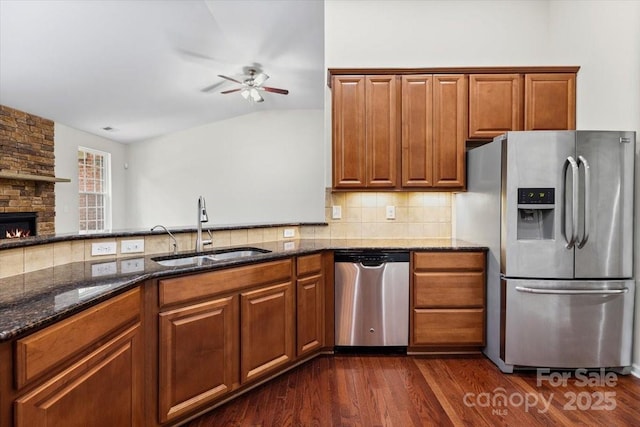 9506 Minnie Lemmond Ln Unit 170, Mint Hill, NC 28227 - kitchen with stainless steel appliances, a sink, ceiling fan, dark stone countertops, and lofted ceiling
