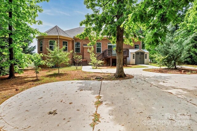 9506 Minnie Lemmond Ln Unit 170, Mint Hill, NC 28227 - view of front facade with a storage shed, an outbuilding, brick siding, and a patio area