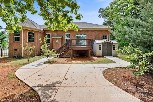 9506 Minnie Lemmond Ln Unit 170, Mint Hill, NC 28227 - back of property featuring a storage shed, a wooden deck, brick siding, and stairway