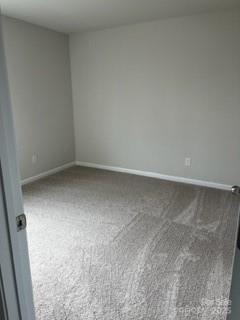 438 Phifer Rd, Kings Mountain, NC 28086 - spare room featuring carpet and baseboards