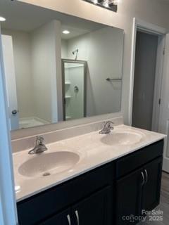 438 Phifer Rd, Kings Mountain, NC 28086 - bathroom with double vanity and a stall shower