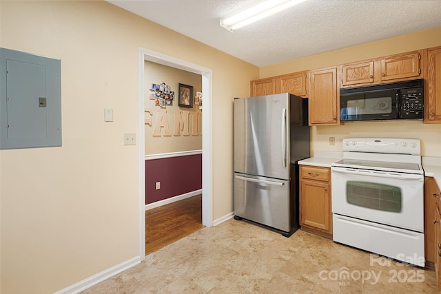 kitchen with electric panel, light countertops, freestanding refrigerator, black microwave, and white electric range oven