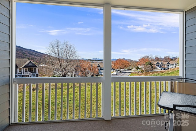 balcony featuring a mountain view and a residential view