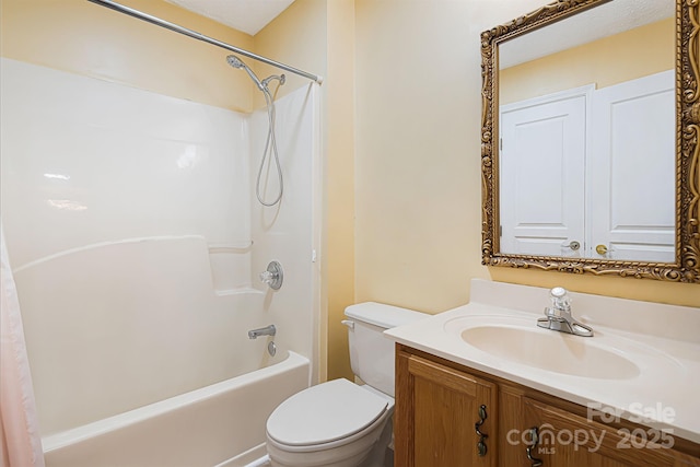 bathroom featuring toilet, vanity, and shower / bathtub combination