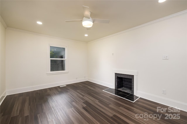 2741 Cowles Rd, Charlotte, NC 28208 - unfurnished living room featuring crown molding, baseboards, a tiled fireplace, and dark wood-style flooring