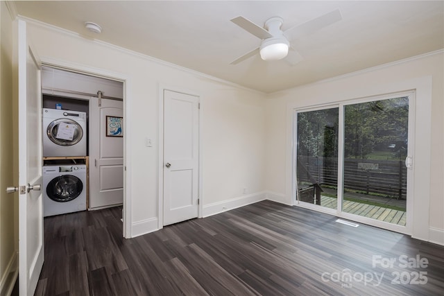 2741 Cowles Rd, Charlotte, NC 28208 - spare room featuring crown molding, dark wood-type flooring, baseboards, ceiling fan, and stacked washer / dryer