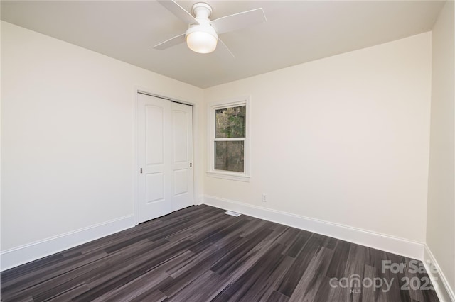 2741 Cowles Rd, Charlotte, NC 28208 - empty room with dark wood-style floors, baseboards, and ceiling fan