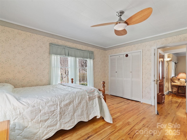 195 Nature Ln, Waynesville, NC 28786 - bedroom with a closet, wood finished floors, baseboards, wallpapered walls, and ceiling fan