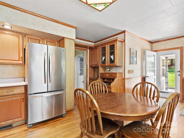 195 Nature Ln, Waynesville, NC 28786 - dining space featuring ornamental molding, visible vents, light wood-type flooring, and wainscoting