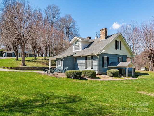 195 Nature Ln, Waynesville, NC 28786 - back of house with a lawn, a chimney, a patio, and roof with shingles